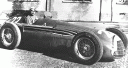 [thumbnail of 1951 alfa romeo 159 - juan manuel fangio at alfa romeo factory, portello, after winning championship.jpg]